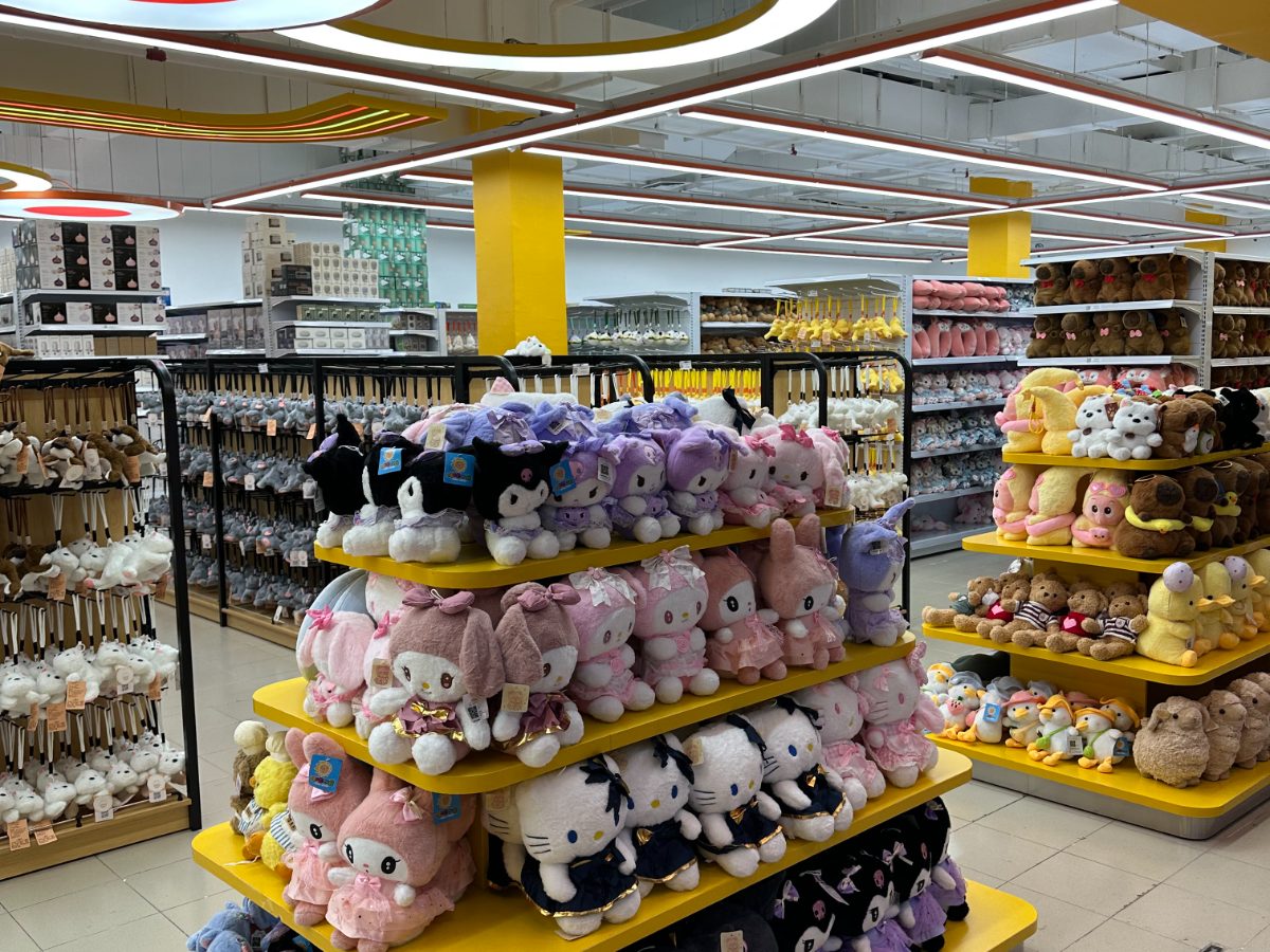 Display stand filled with plush toys in the middle of the shop floor